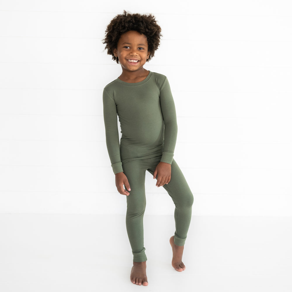 Child wearing a Cozy Olive two piece pajama set