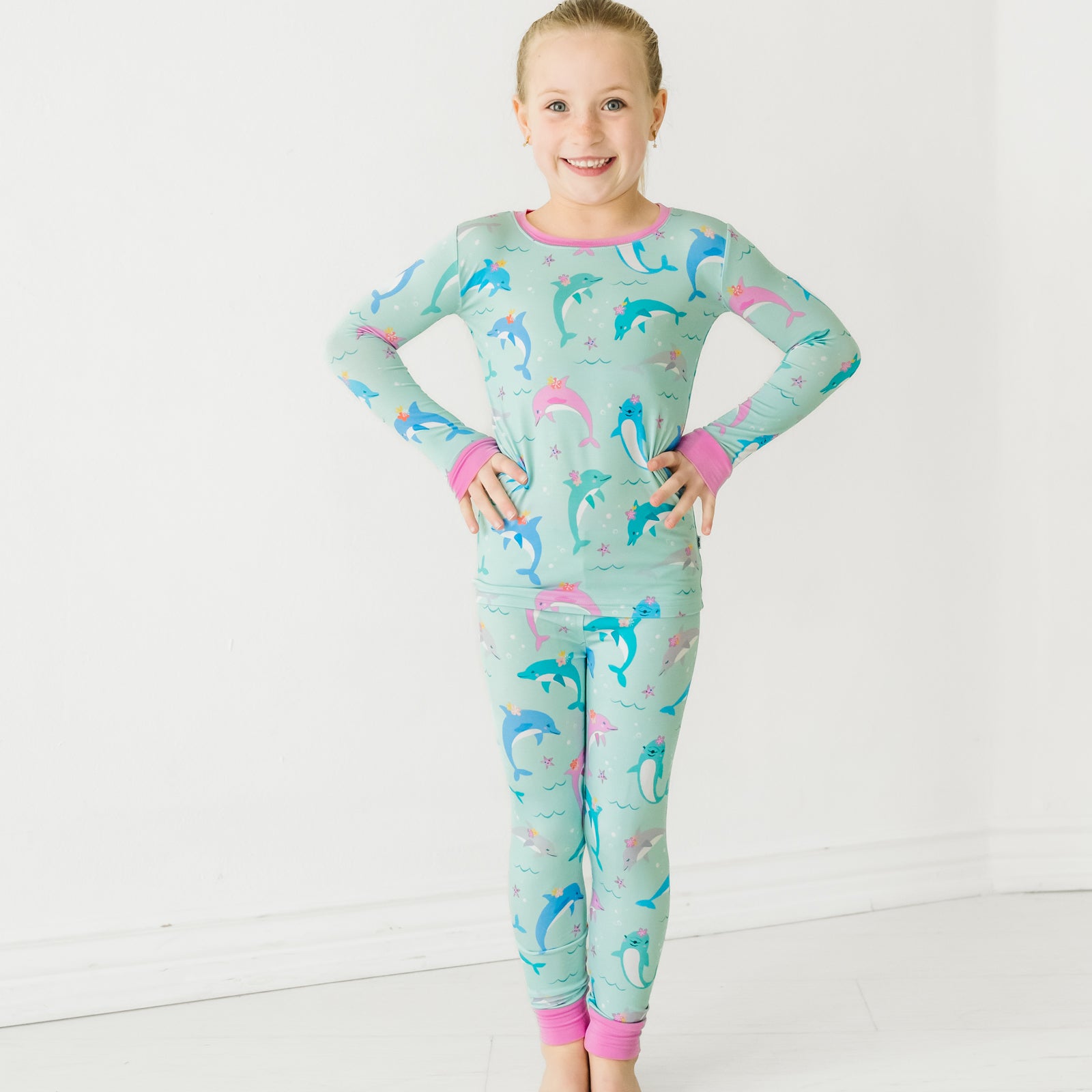 Child wearing a Dolphin Dance two-piece pajama set