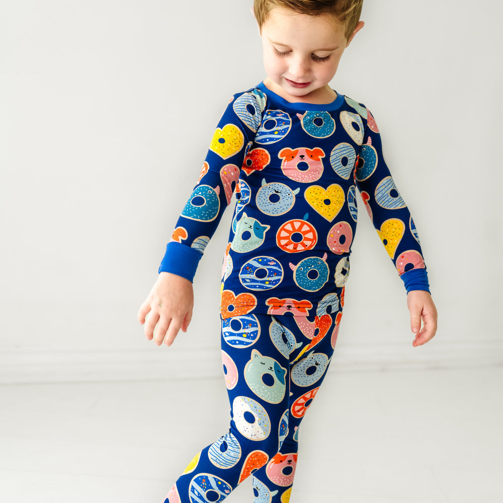 Click to see full screen - close up image of a child wearing Blue Donut Dreams two piece pajama set