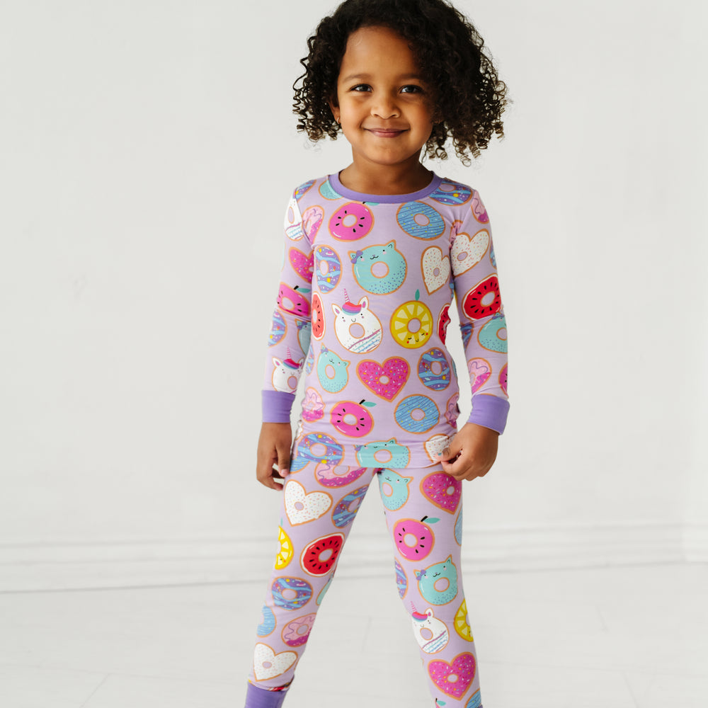 Click to see full screen - Child wearing a Lavender Donut Dreams two piece pajama set