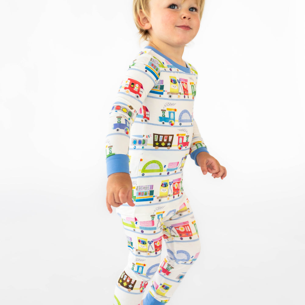 Side view on child wearing the Education Express Two-Piece Pajama Set