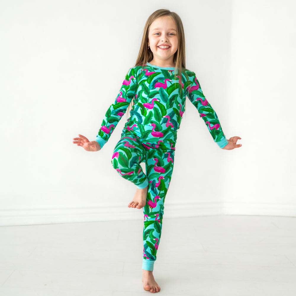 Child posing wearing a Palm Springs two piece pajama set