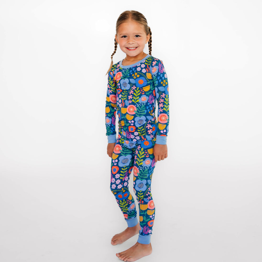 Full body image of girl wearing the Folk Floral Two-Piece Pajama Set