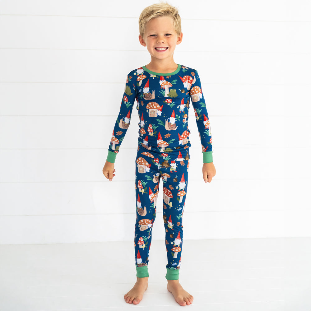 Smiling boy wearing the Forest Gnomes Two-Piece Pajama Set