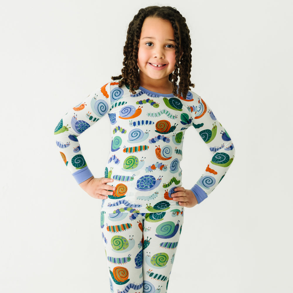 Close up image of a child wearing an Inchin' Along two-piece pajama set