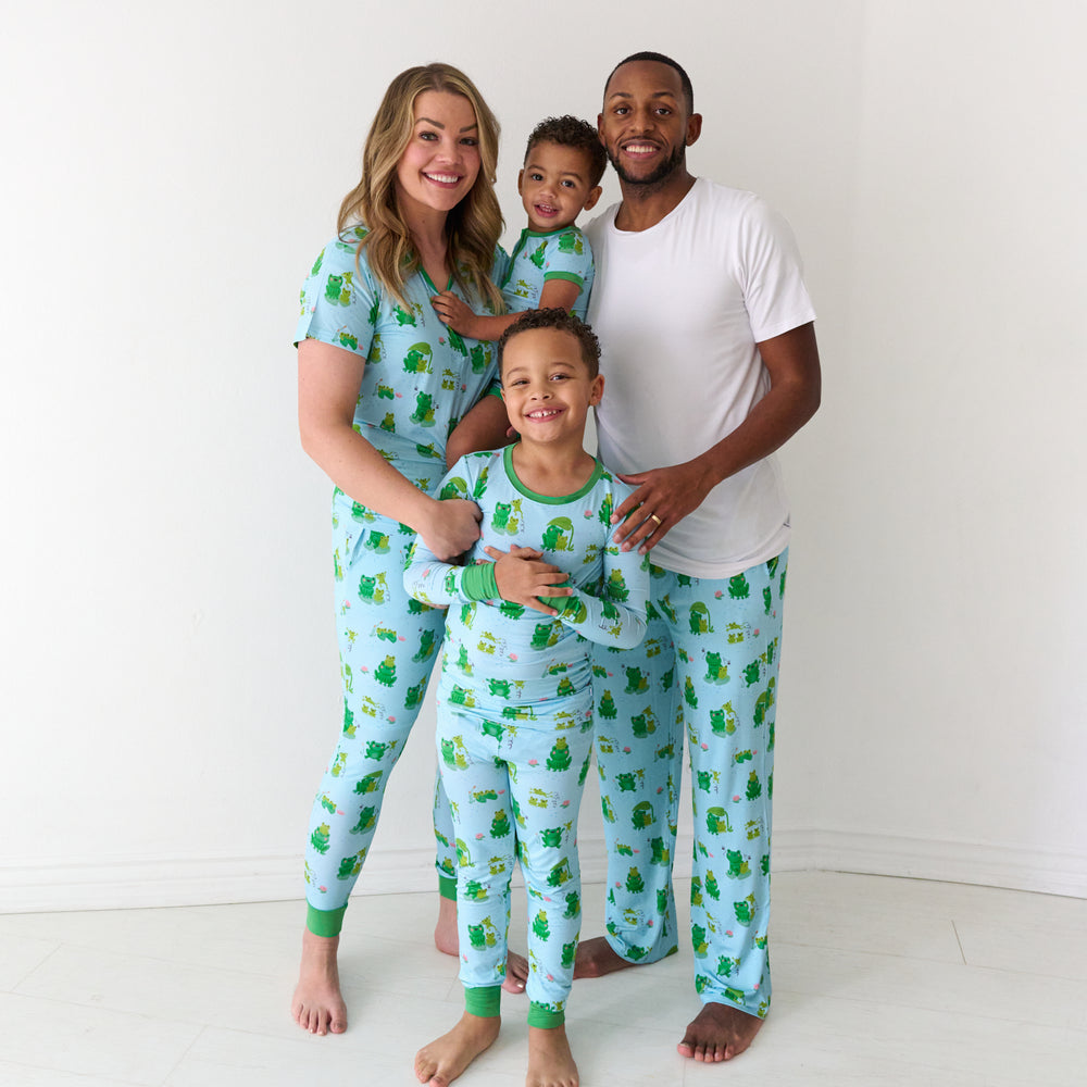 Family of four wearing matching Leaping Love pajamas