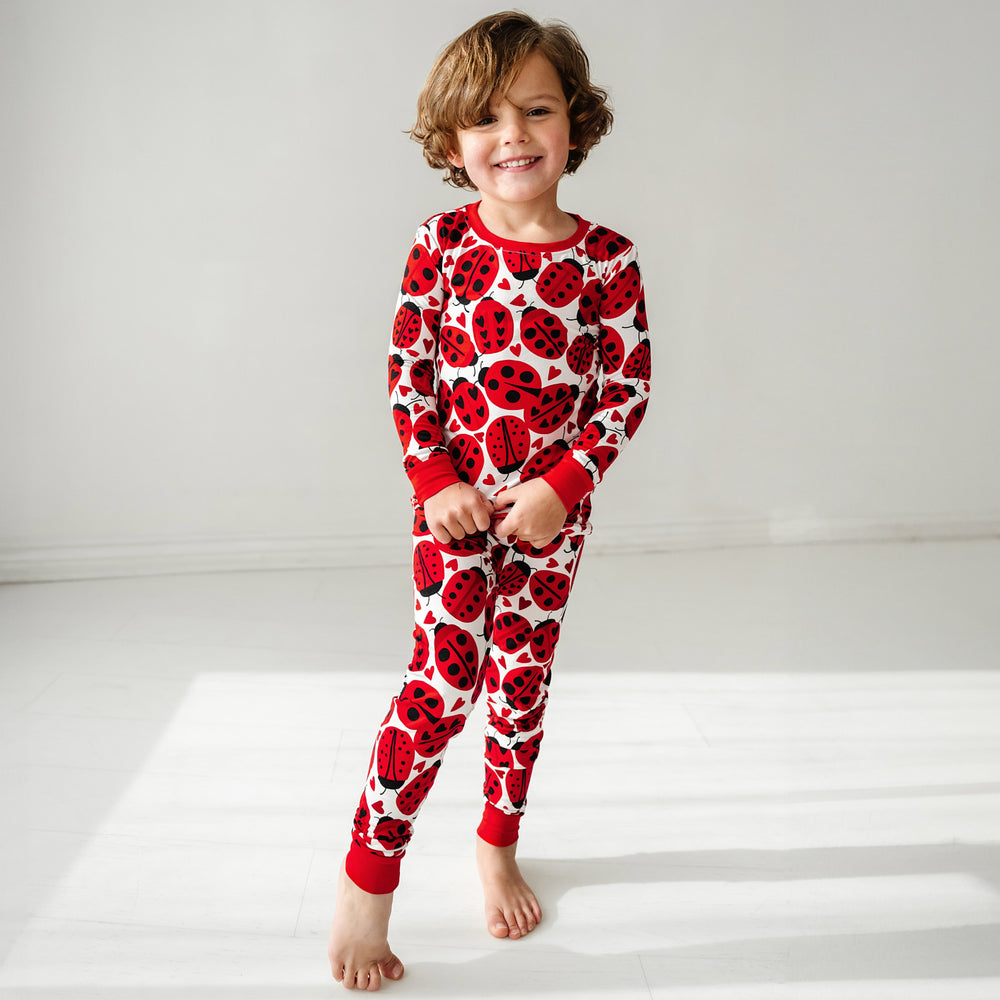 Click to see full screen - Alternate image of a child wearing a Love Bug printed two-piece pajama set