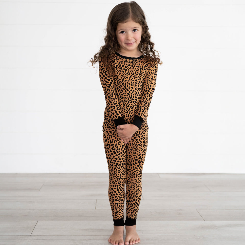 Girl posing while wearing the Classic Leopard Two-Piece Pajama Set