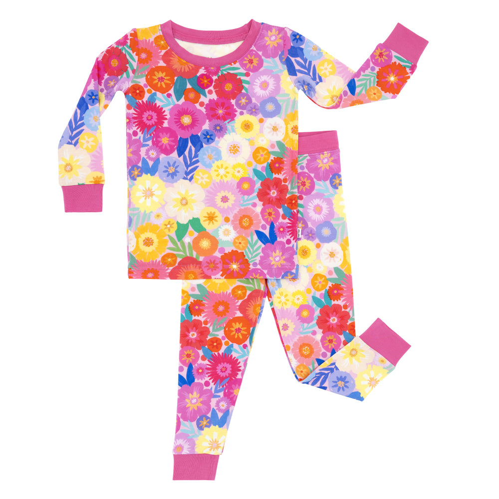 Flat lay image of a Rainbow Blooms two-piece pajama set
