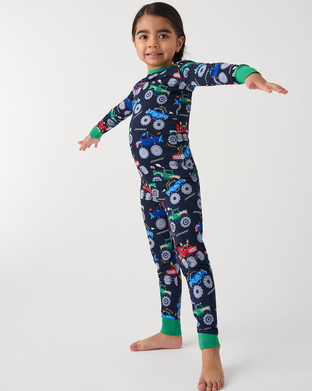 Posing girl wearing the Monster Truck Madness Two-Piece Pajama Set
