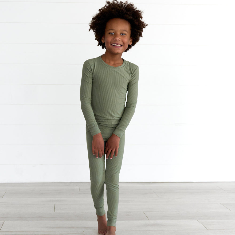 Boy wearing the Moss Ribbed Two-Piece Pajama Set