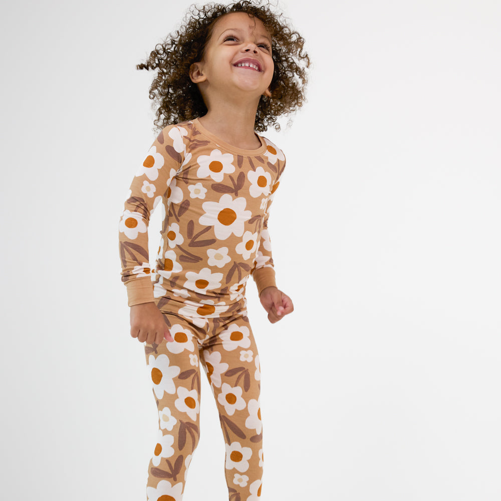 Image of a child wearing a Daisy Daydream two piece pajama set