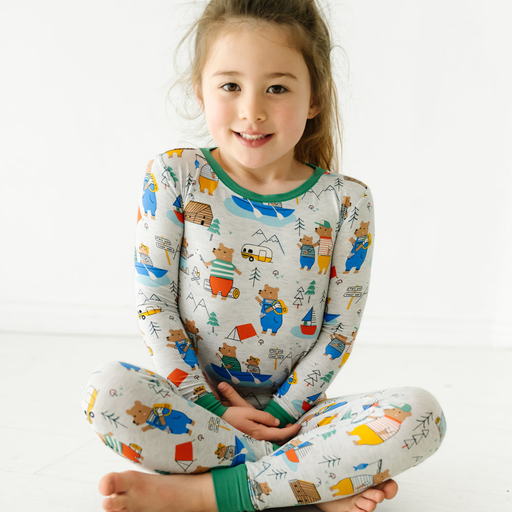 Child sitting wearing Papa Bear two piece pajama set