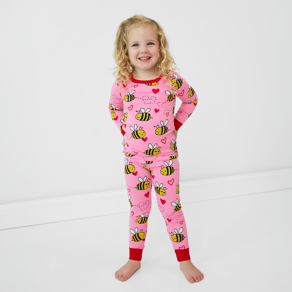 alternate image of a child posing wearing a Pink Bee Mine two piece pj set