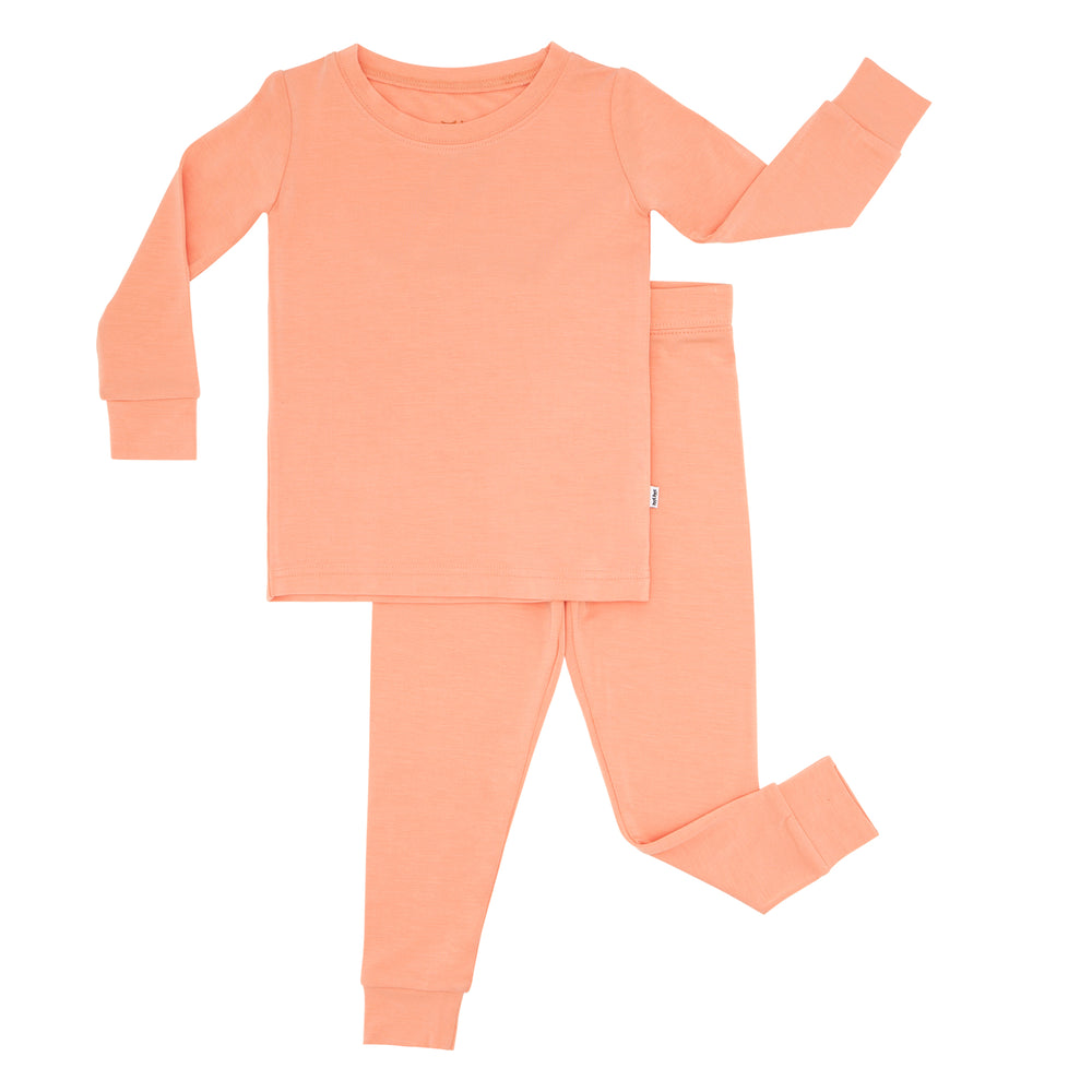 Flat lay image of a Peach two piece pajama set