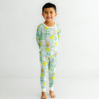 Child wearing a Aqua Pastel Parade two piece pajama set