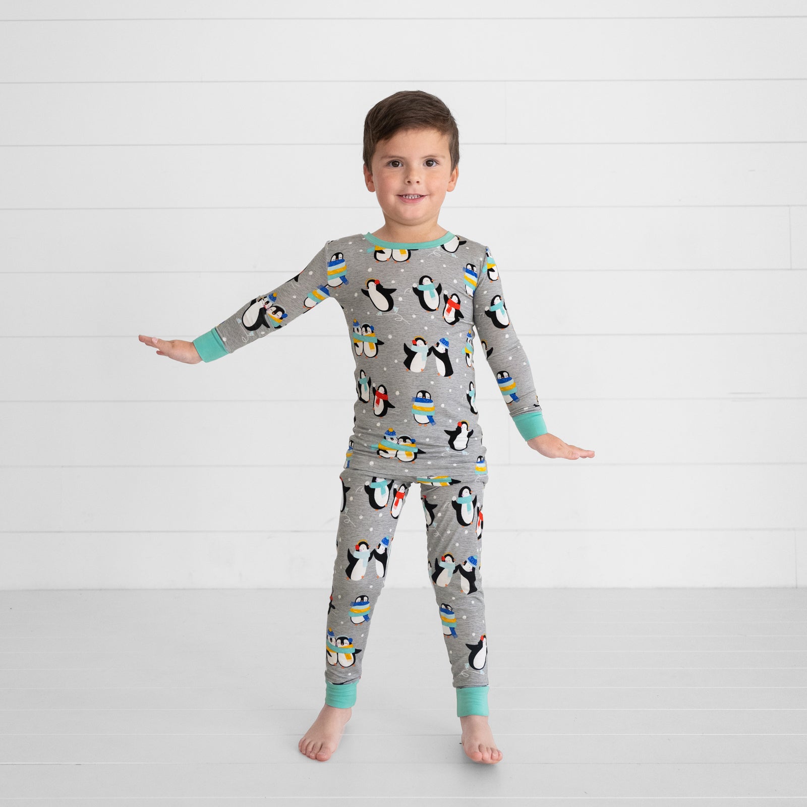 Child wearing Penguin Party two piece pj set