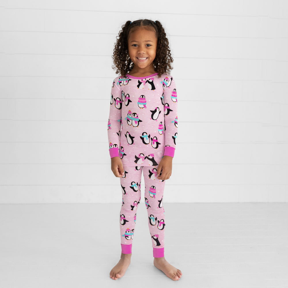 child wearing pink Penguin Party two piece pajama set