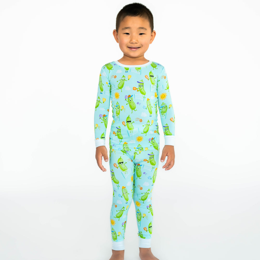 Boy standing while wearing the Pickle Power Two-Piece Pajama Set