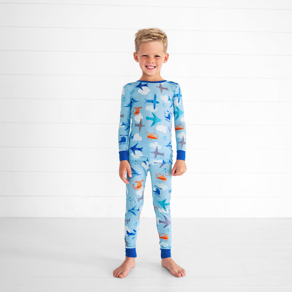 Child wearing a Let's Fly two piece pj set