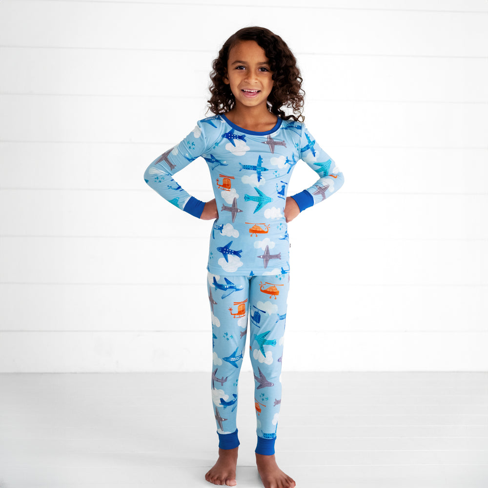 Alternate image of a child posing wearing a Let's Fly two piece pj set