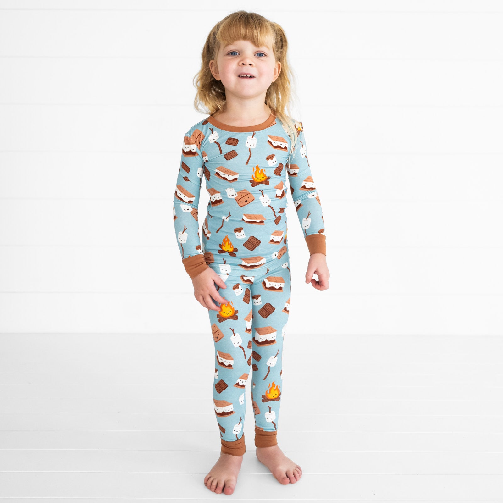 Child wearing a S'mores Galore two piece pj set