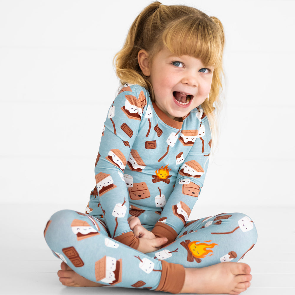 Child sitting wearing a S'mores Galore pj set