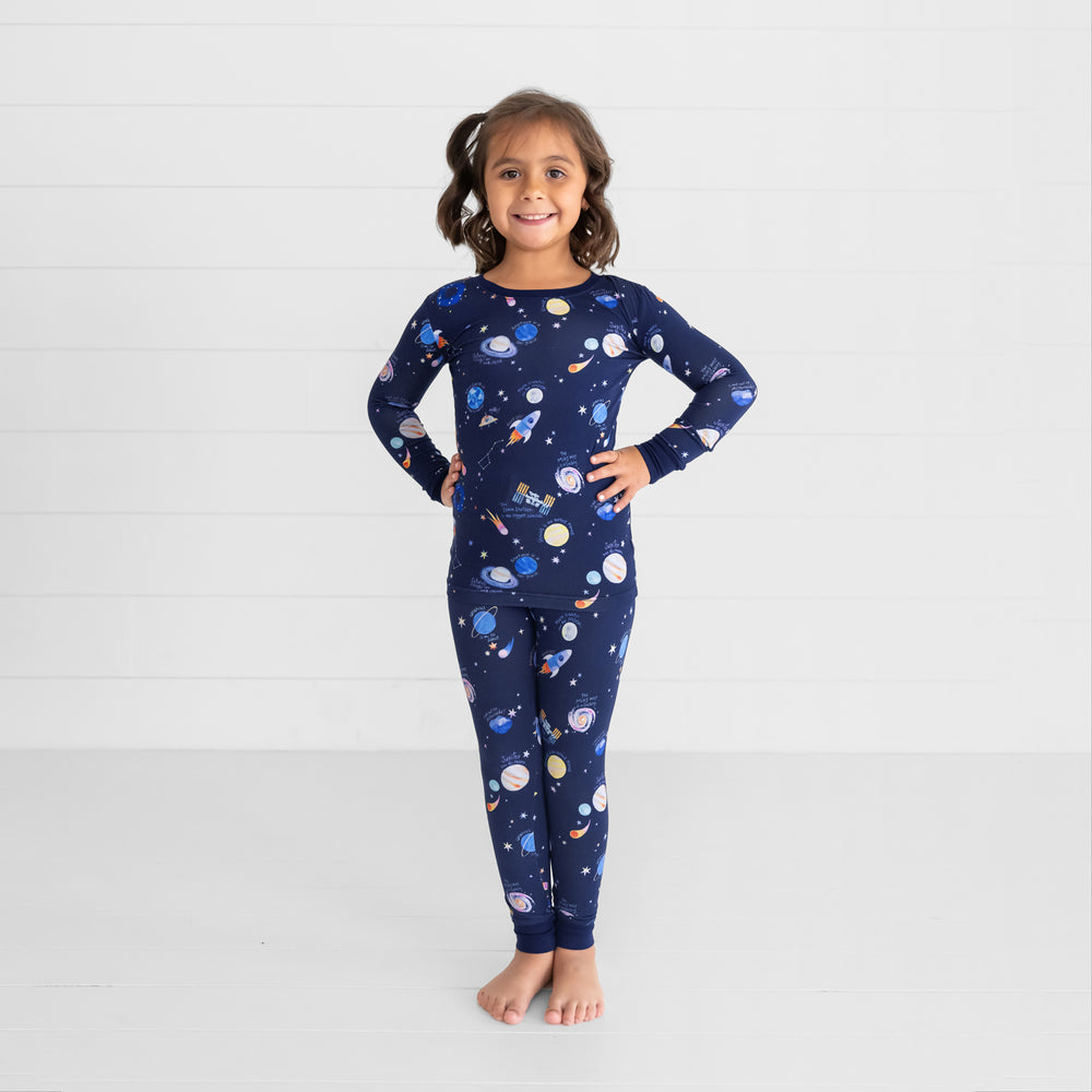 Image of a child posing wearing a Through My Telescope two piece pj set