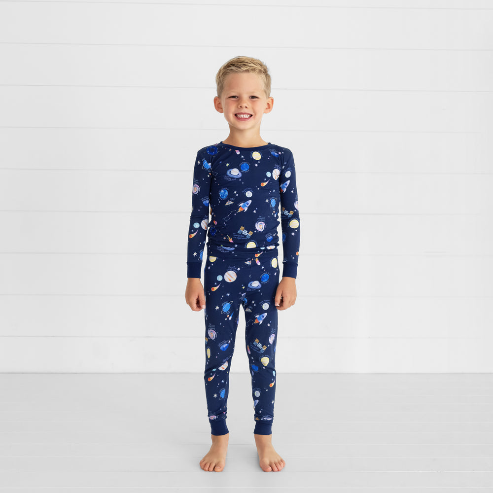 Image of a child wearing a Through My Telescope two piece pj set