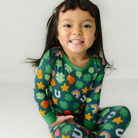 Close up image of a child wearing a Lucky two piece pajama set