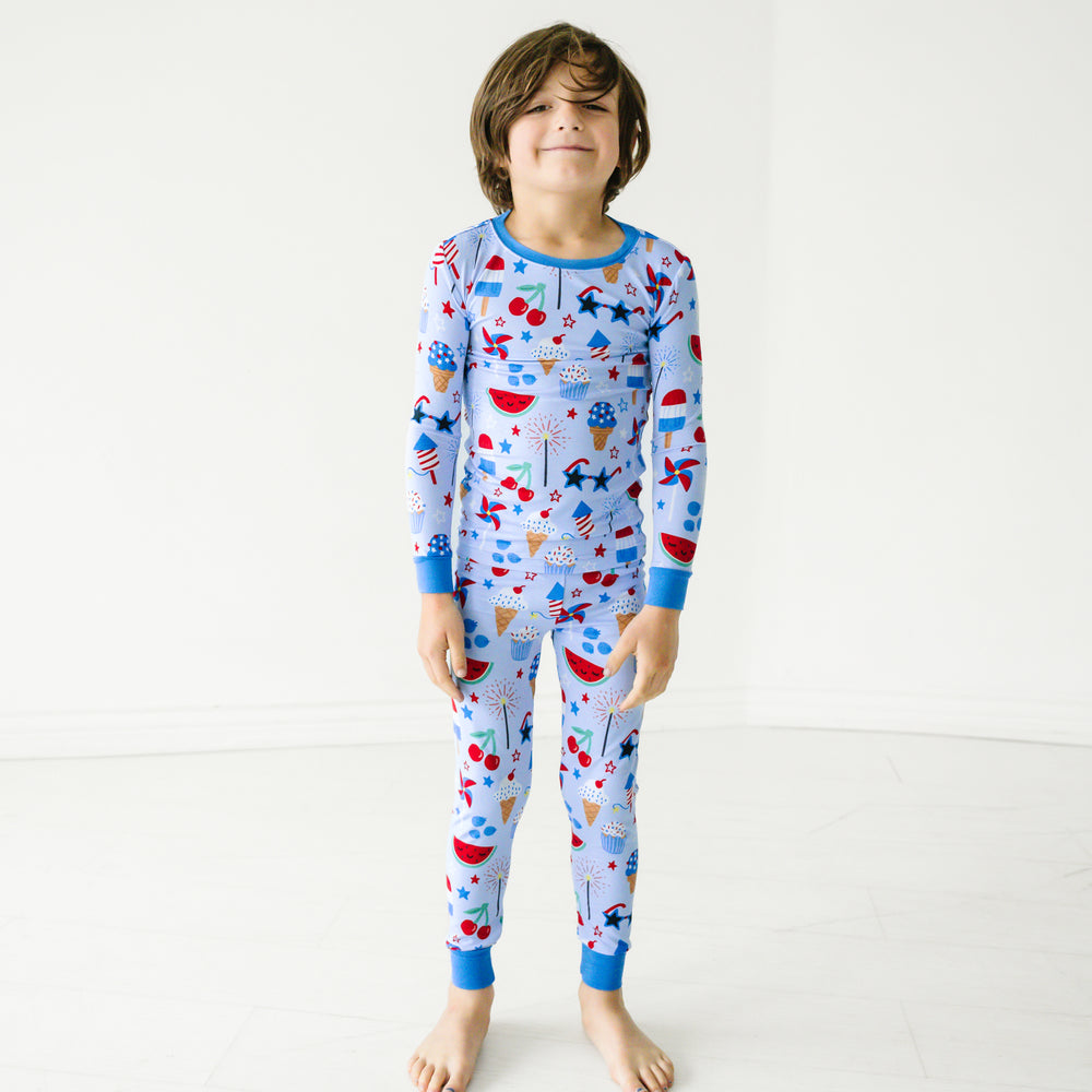 Child wearing a Stars, Stripes, and Sweets two piece pajama set