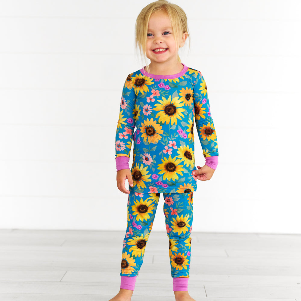 Girl wearing the Sunflower Fields Two-Piece Pajama Set