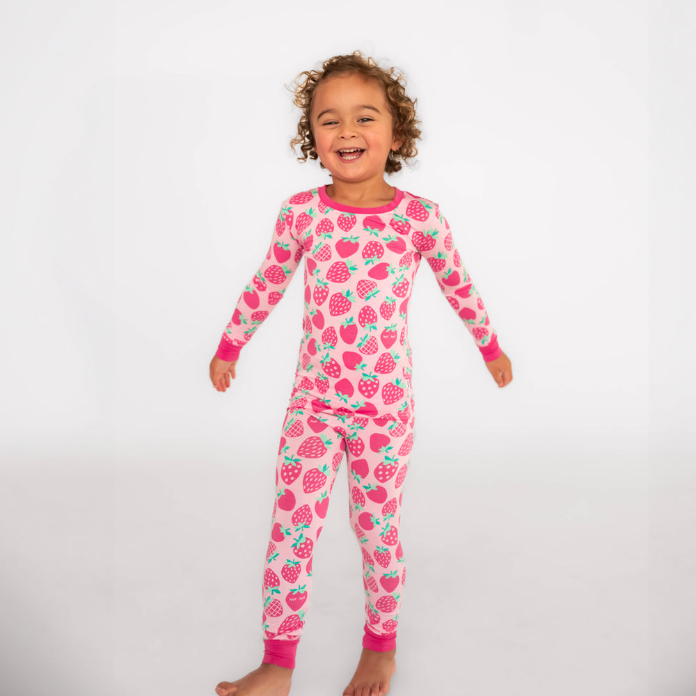 Girl posing while wearing the Sweet Strawberries Two-Piece Pajama Set