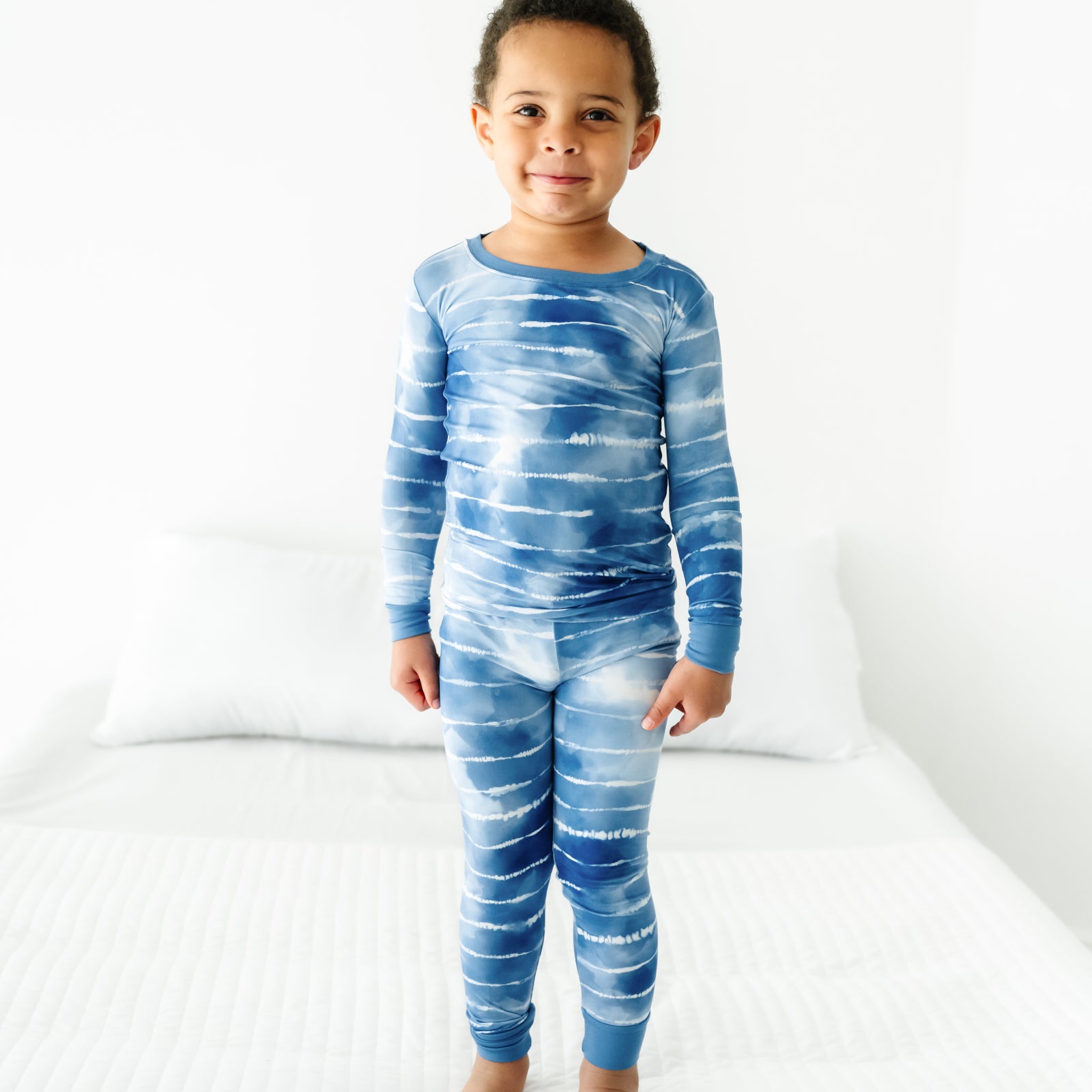Child wearing a Blue Tie Dye Dreams two-piece pajama set
