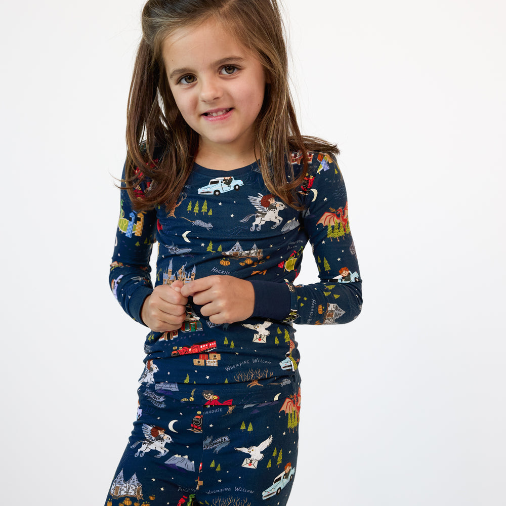 Close up image of a child wearing An Evening at Hogwarts two piece pj set