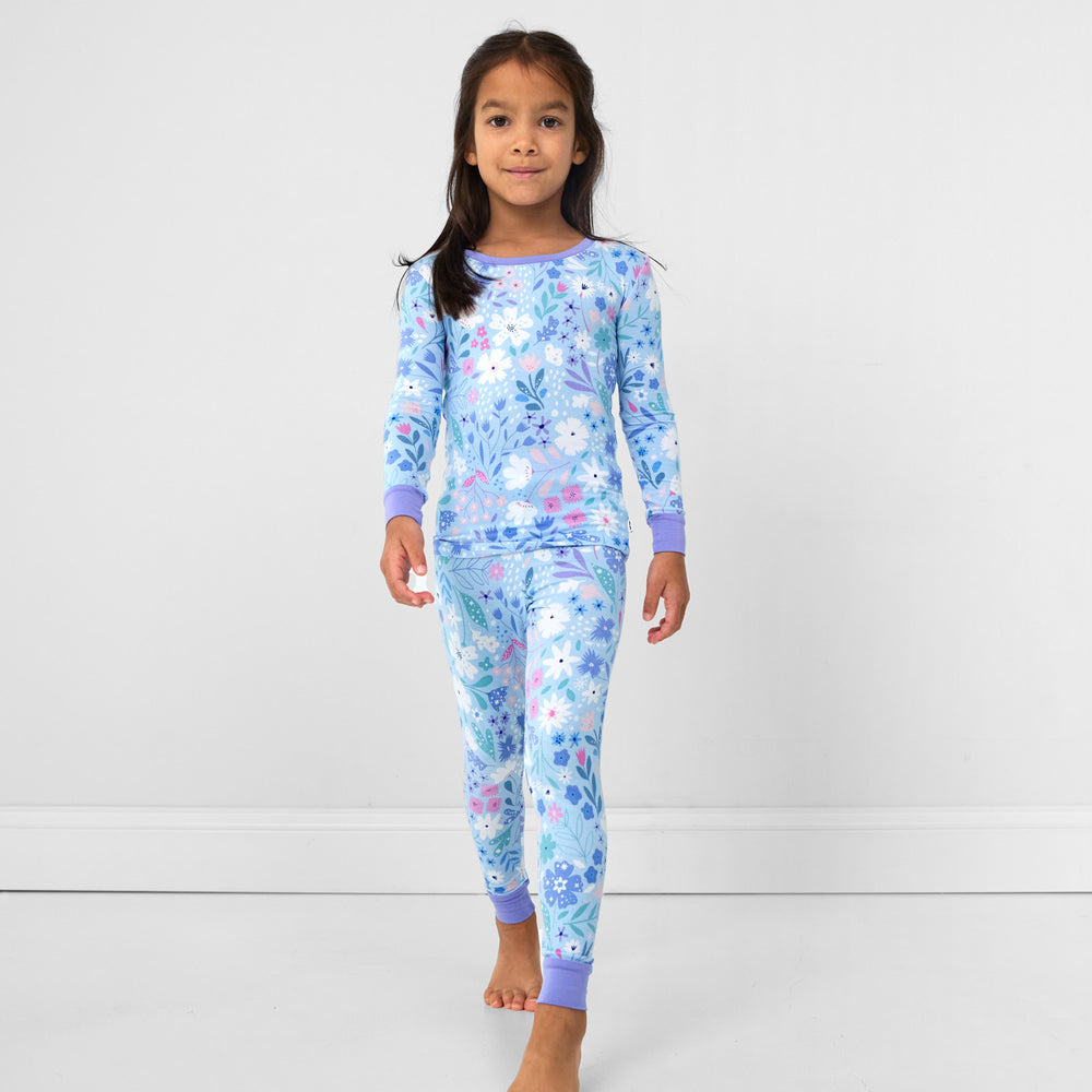 Image of a child wearing a Magical Meadow two piece pj set