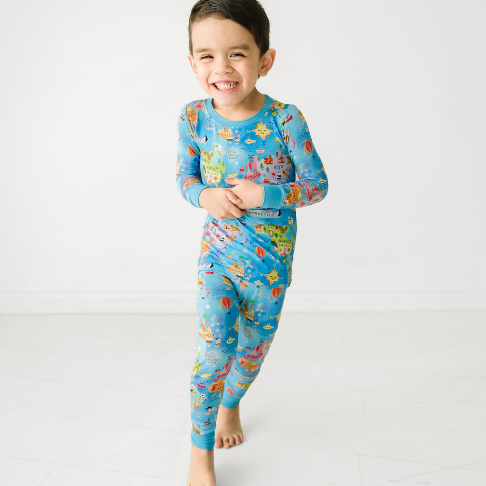 Child playing wearing an Around the World two piece pajama set