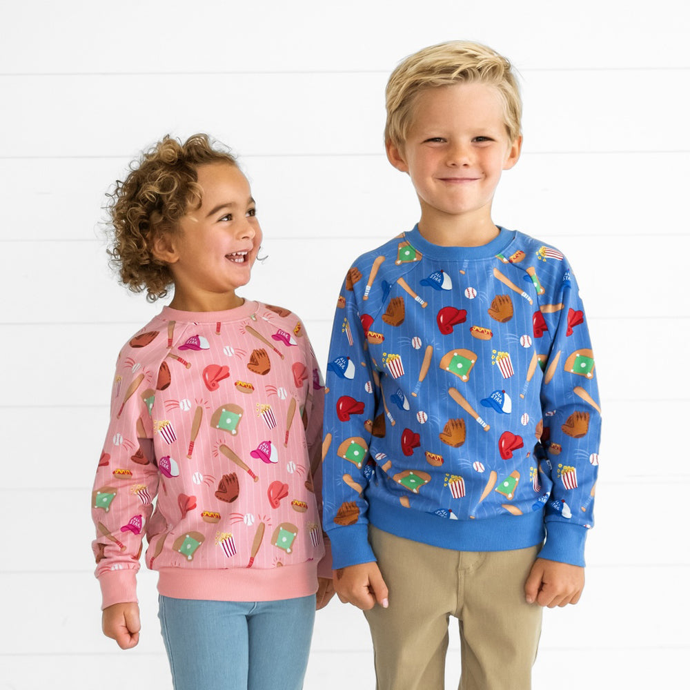 Two children wearing coordinating All Stars Crewneck Sweatshirts