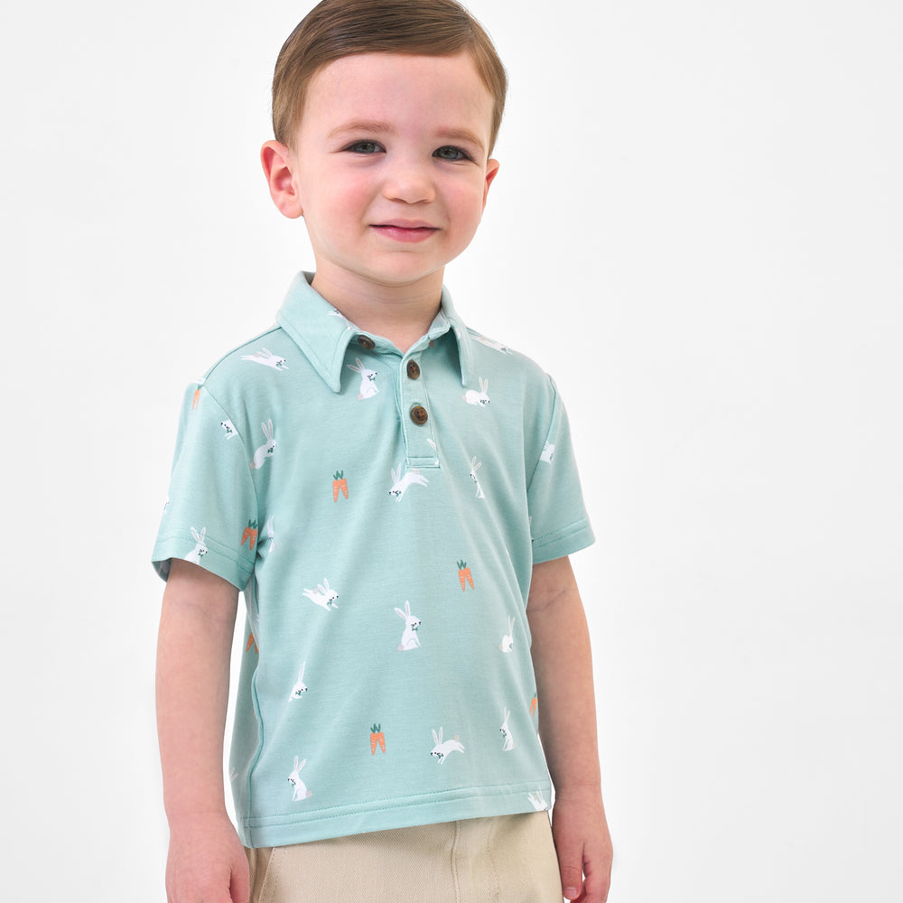 Click to see full screen - Child wearing a Bunny Hops polo shirt and coordinating shorts
