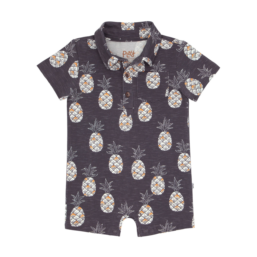 Flat lay image of a Sweet Paradise polo shorty romper