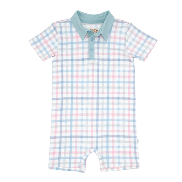 Flat lay image of a Playful Plaid polo shorty romper