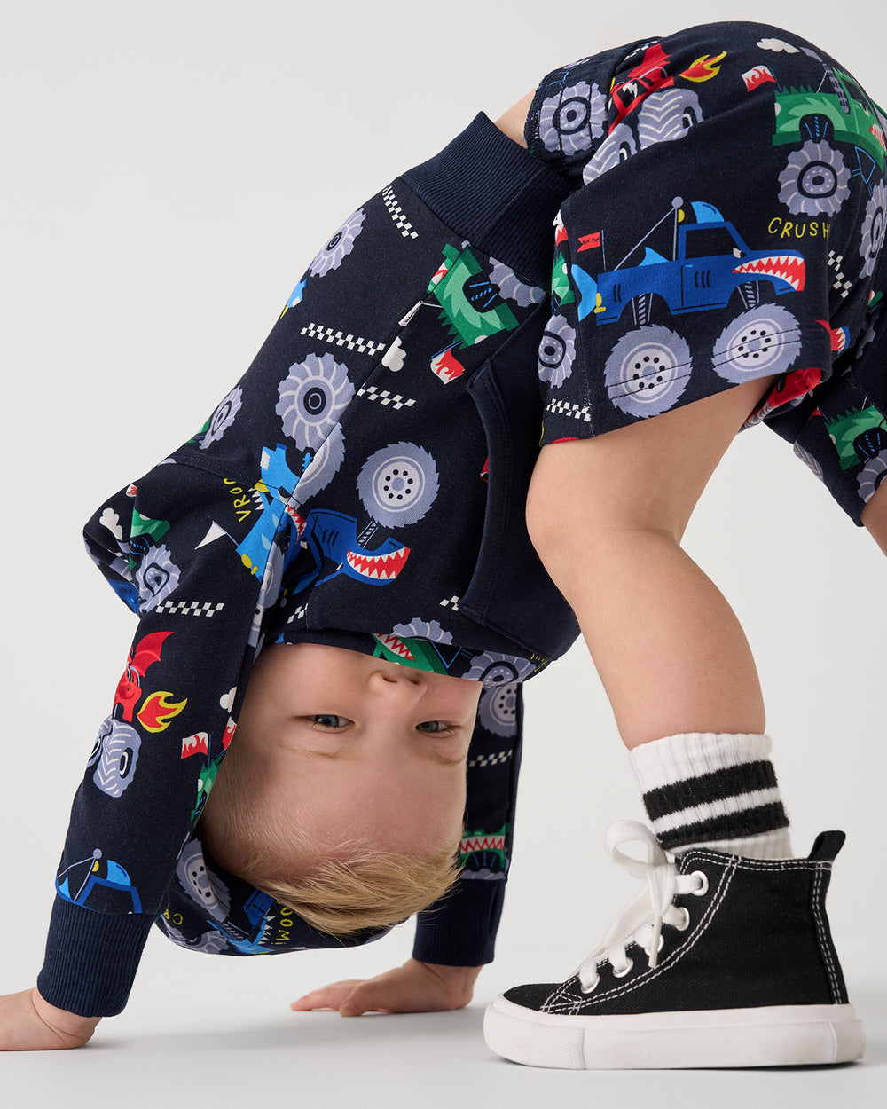 Boy wearing the Monster Truck Madness Drawstring Shorts and Hoodie