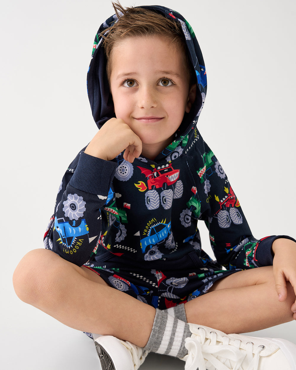 Sitting boy wearing the Monster Truck Madness Pullover Hoodie