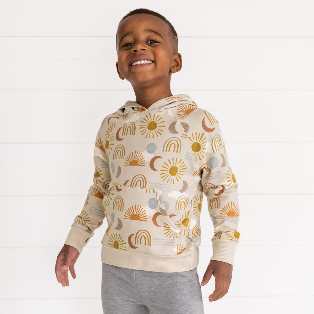 Image of a child wearing a Desert Sunrise Pullover Hoodie and Heather Gray Jogger