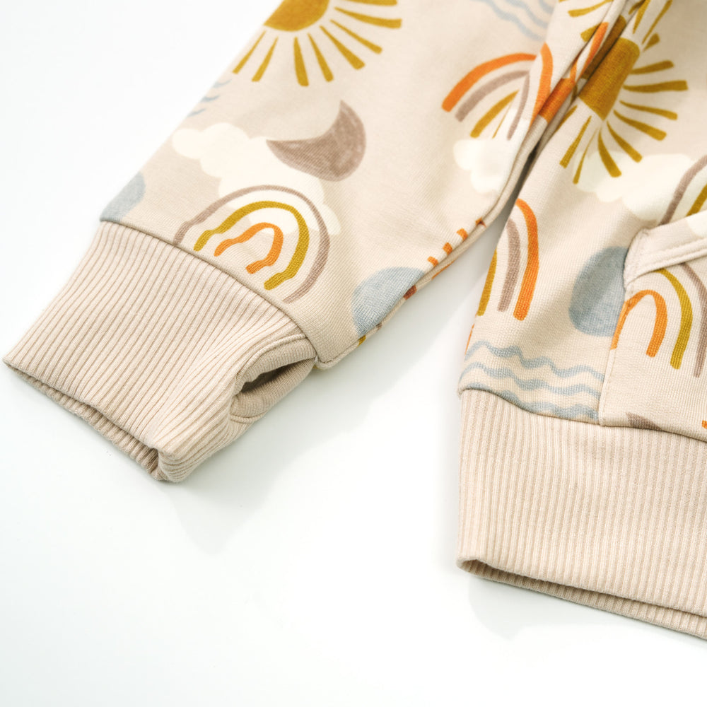 Close up detail shot of the cuff thumbhole on a Desert Sunrise Pullover Hoodie