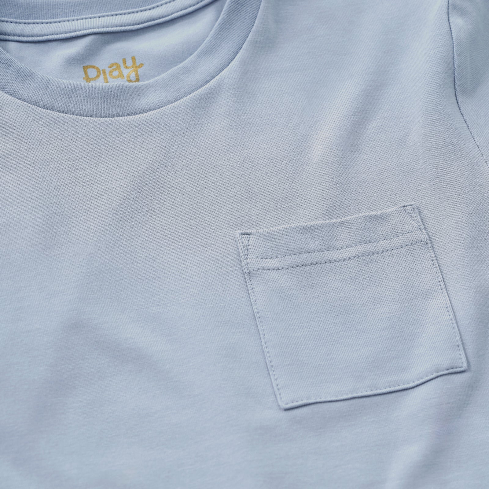 Close up image of a Fog Relaxed Pocket Tee chest pocket detail
