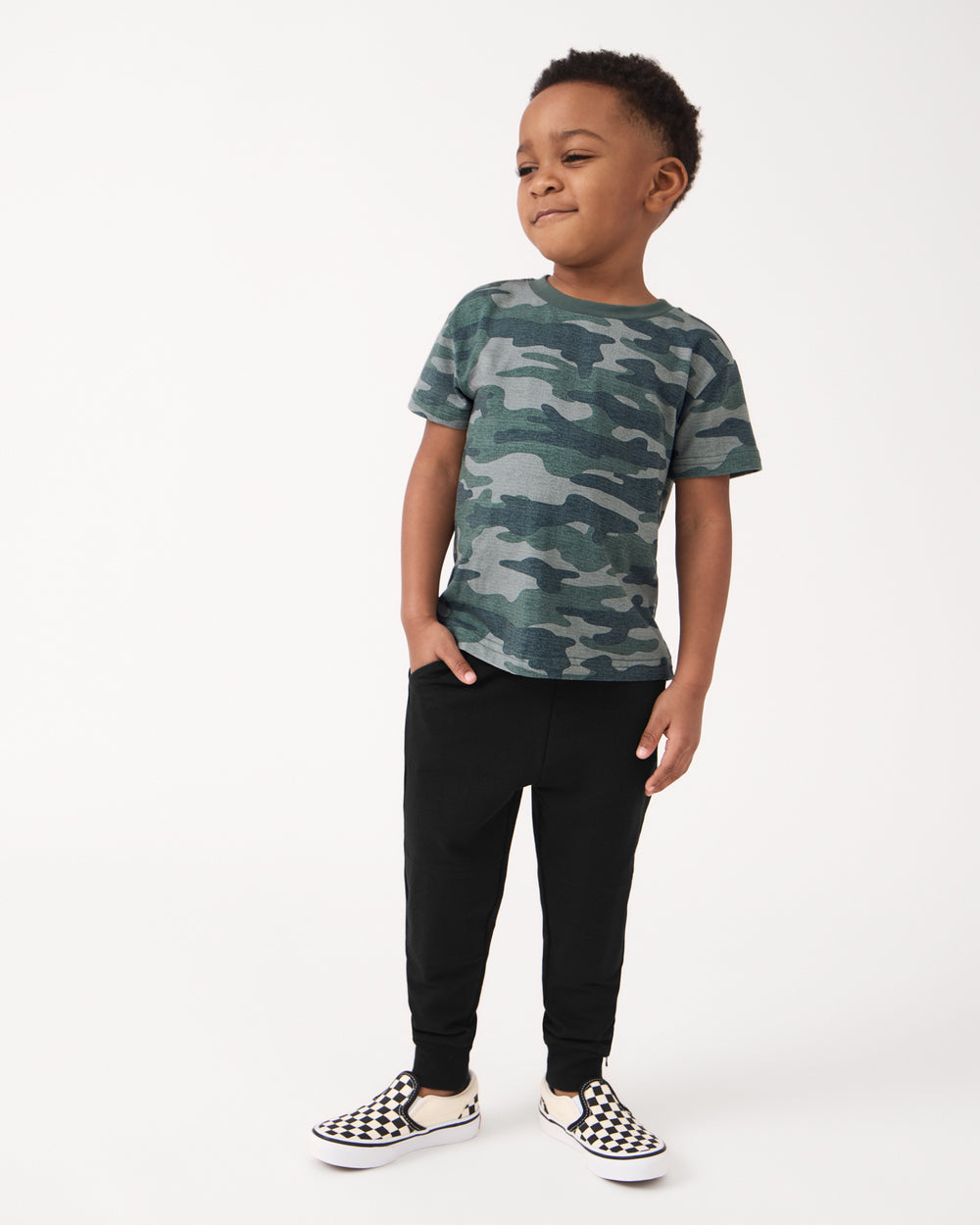 Boy wearing the Vintage Camo Short Sleeve Relaxed Tee with Black Joggers