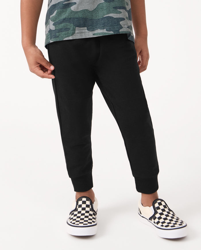 Front view of child wearing the Black Jogger