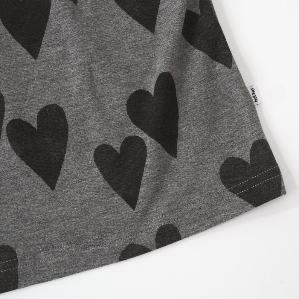 close up view of the bottom hem of a heather hearts relaxed tee