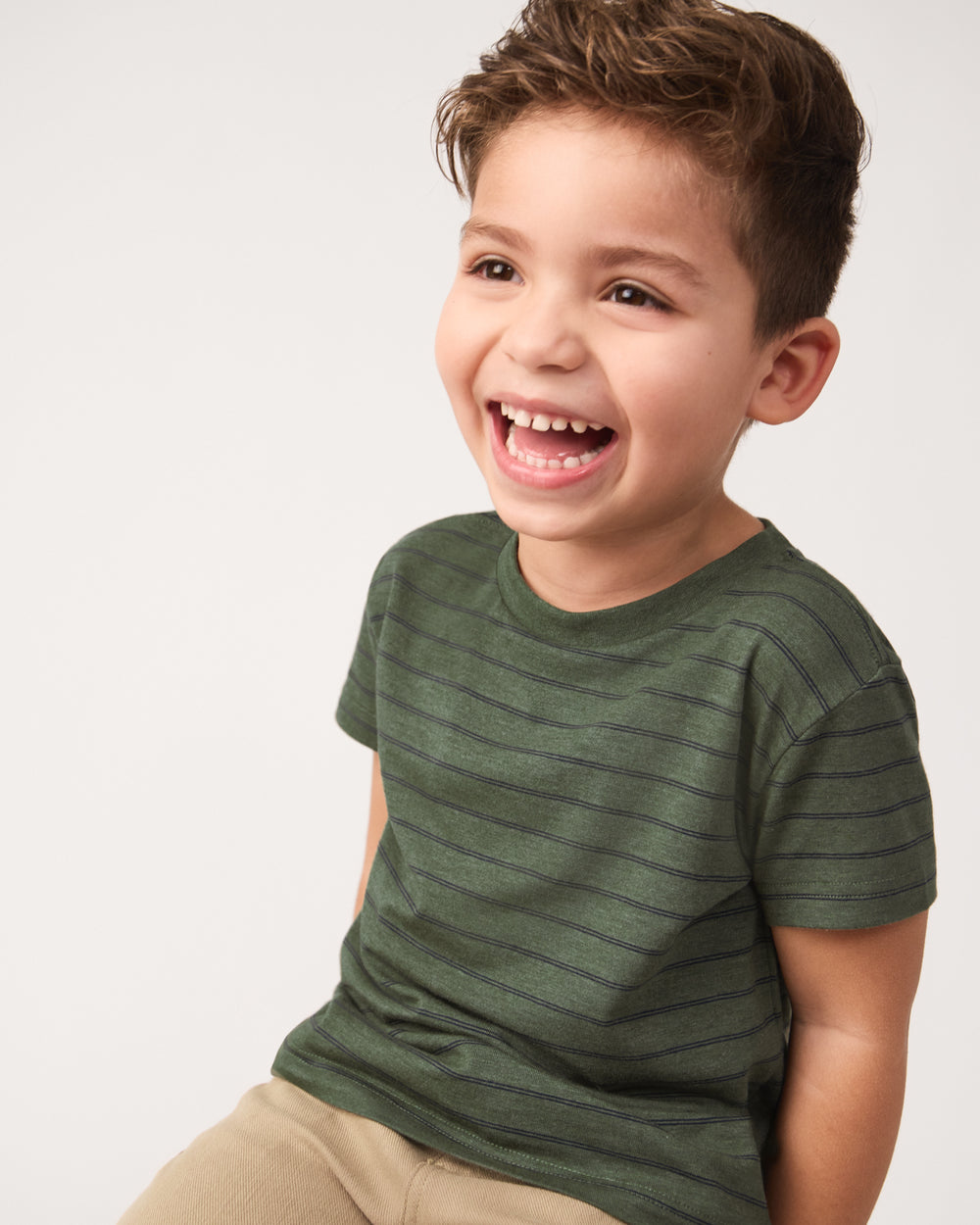 Close up of boy wearing the Olive Stripes Short Sleeve Relaxed Tee